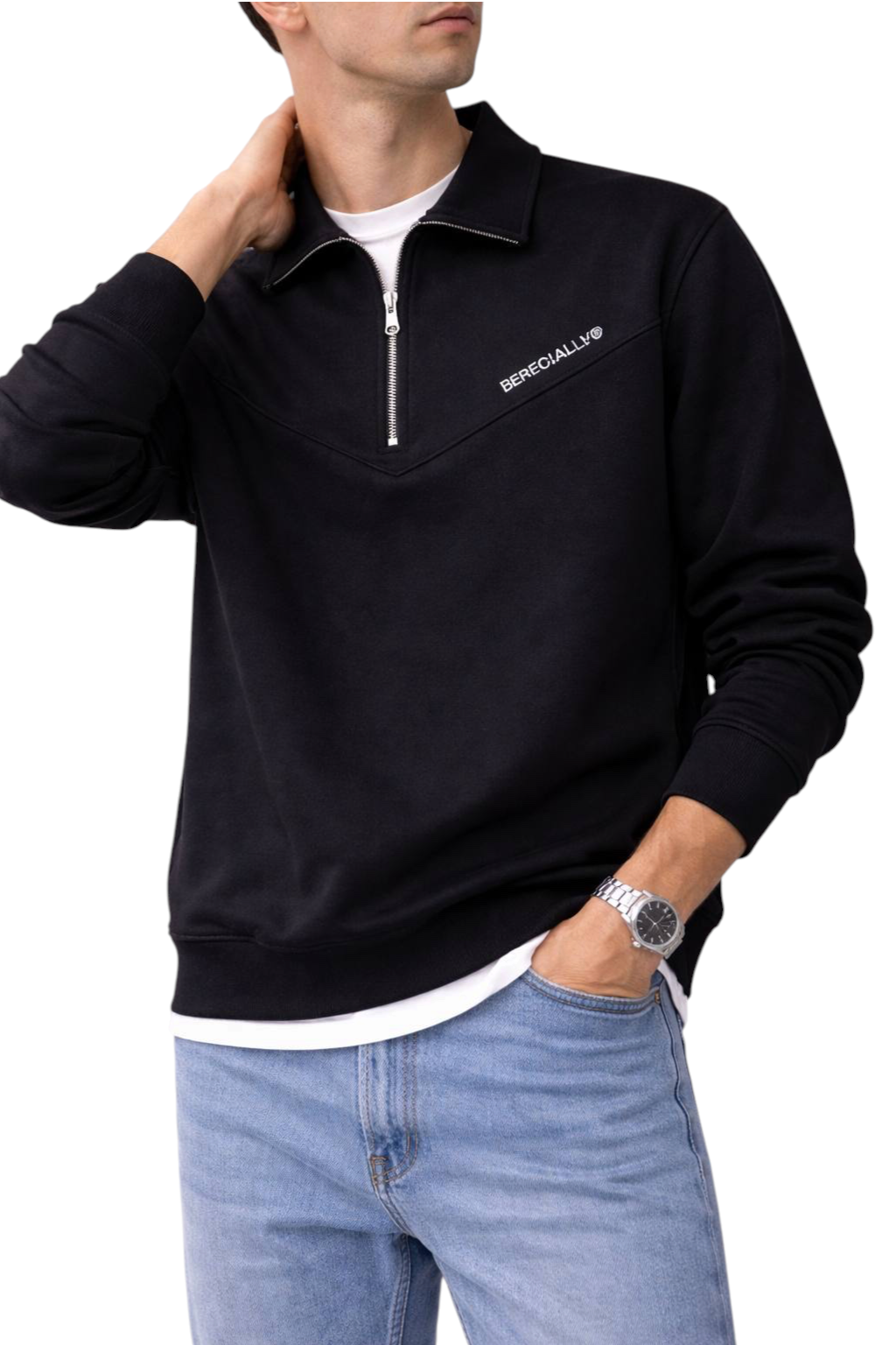 Golinzo ESPECIALLY black quarter-zip sweatshirt with stand collar worn by a man with a silver watch and blue jeans